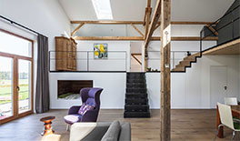 Wohnung 1 - Wohnraum mit Blick in den höher gelegenen Bad- und Schlafbereich - Tina Assmann - Innenarchitektur - München